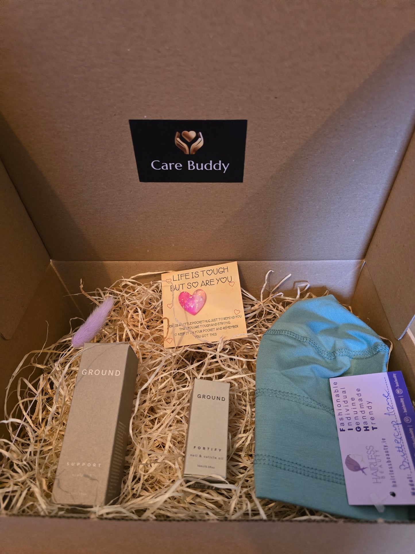 Chemo Care Buddy Box including a soft Sleep Cap, Ground Wellbeing Nail & Cuticle Oil, Ground Wellbeing Scalp Oil and a Pocket Heart