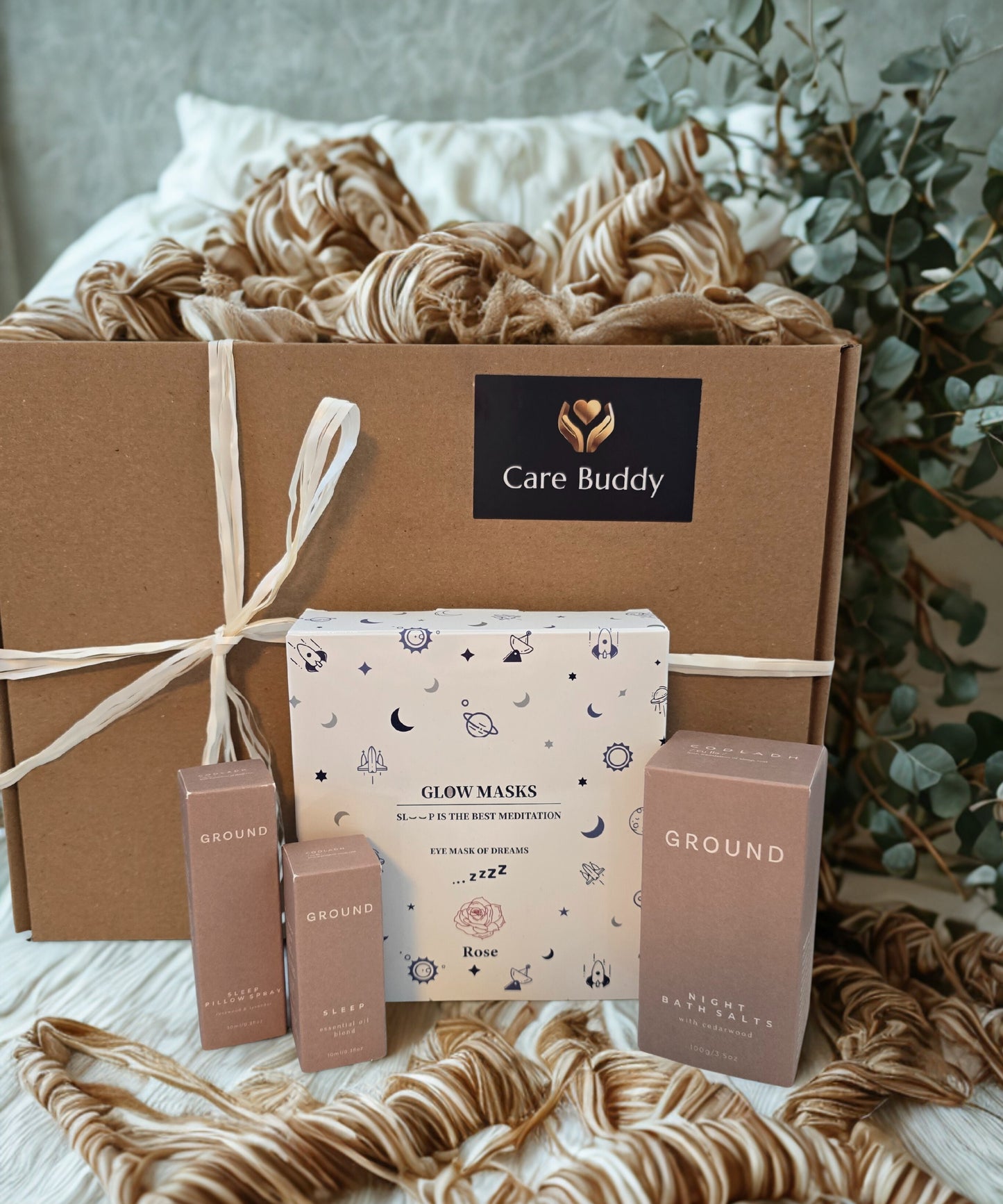 Care Buddy Box containing pack of 5 Glow Masks, Ground Wellbeing Night Bath Salts, Ground Wellbeing Sleep Essential Oil, Ground Wellbeing Sleep Pillow Spray