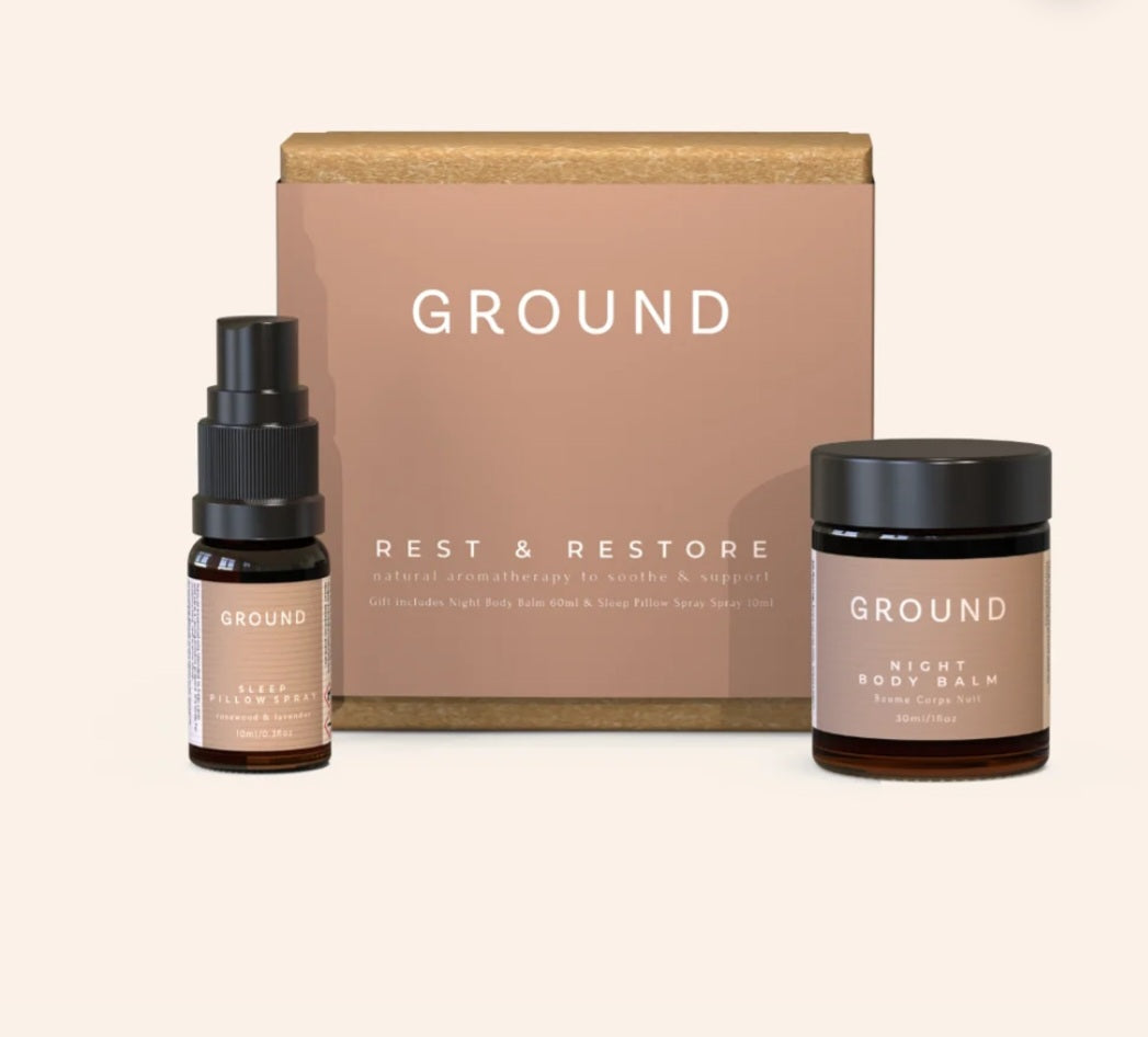 A Groundwellbeing 'Rest & Restore' natural aromatherapy Night Gift Set featuring a Sleep Pillow Spray 10ml Bottle and a 30ml jar of Night Body Balm presented in a beautiful Ground Gift Box.