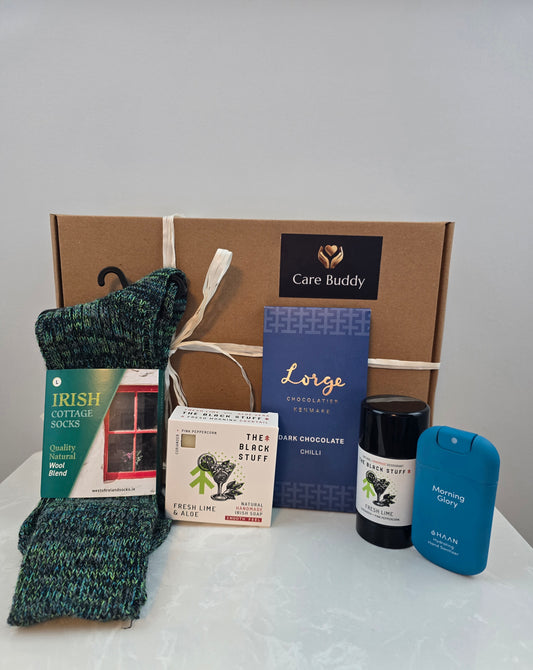 Collection of items including socks, chocolate, The Black Stuff Body soap, The Black stuff natural deodrant, Hydrating Hand Sanitizer