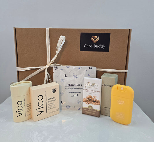 Care Buddy box with Vico natural Deodrant and Body Soap. Glow Mask. Butlers Choc bar. Haan Hydrating Sanitizer and Ground Wellbeing Face & Body oil